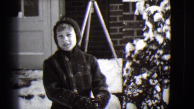 1944: winter boy eats a candy MICHIGAN