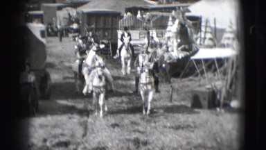 1948: people are seen riding horses and coming back from an act in a circus