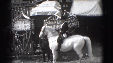 1948: man in uniform riding a white horse performing dressage CHICAGO