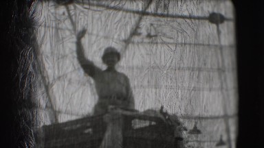 1948: a personality wanders standing in a basket on an animal during a colonial