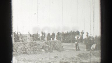 1952: Bricklayers Working at a Large Church Visited by Sailors in Uniform