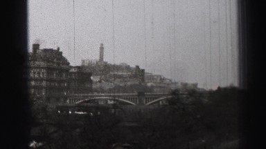 1952: a bridge is seen from a mountain area with greenery and trees EDINBOURGH