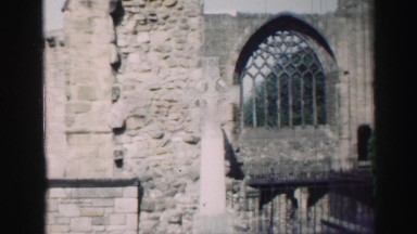 1952: Architectural Details of a Massive Stone Building with a Large Ornate