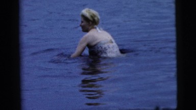 1961: Women Hopping in Shallow Water at a Lake in Camden, New Jersey