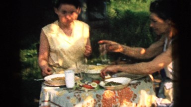 1961: family picnic outdoors serving homemade food for the summer months