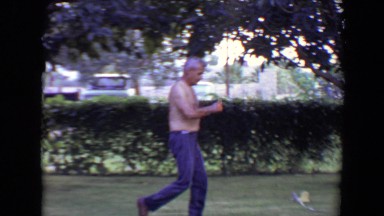 1961: lawn, man, father, boy, son, dog, sprinkler, heat, sweat, outside TOLEDO,