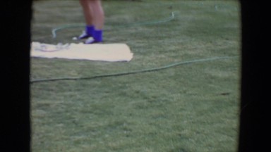 1961: two boys playing fetch with dog outdoors TOLEDO, OHIO