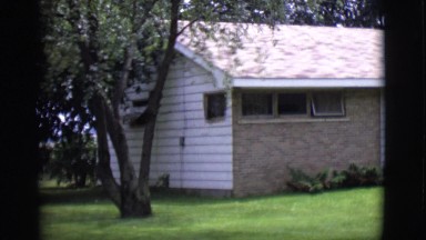 1968: a ranch style house with a green lawn during the day. CLARKSDALE, ARIZONA