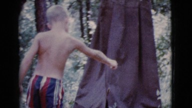 1968: topless kid is seen with a fish COTTONWOOD, ARIZONA