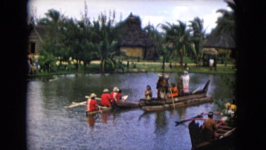 1968: a group of small boats in a lagoon waiting with several people on board