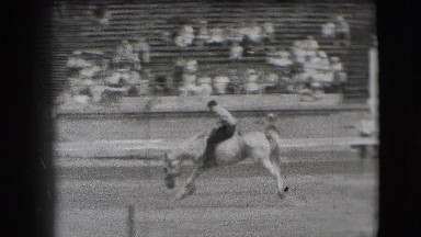 1941: Adult Male Bareback Rider on Galloping Bucking Bronco at California Rodeo