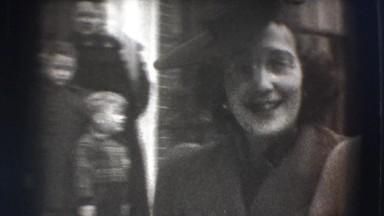 1941: well dressed man and woman walk and wave to camera NEW YORK