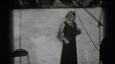 1941: crossdresser gives cloth to sailor on set NEW YORK