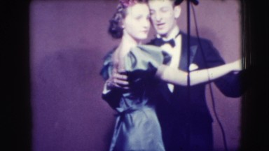 1941: old film of a man and a woman dancing to what seems to be a kinda upbeat