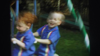 1972: two boys playing on swingset and a baby waking up in crib LYNBROOK