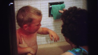 1972: a boy in the bathroom tub being washed by his mother LYNBROOK, NEW YORK