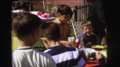 1972: family cookout in backyard with children and hotdogs LYNBROOK, NEW YORK