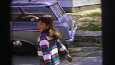 1972: a back yard set up with tables, streamers, presents