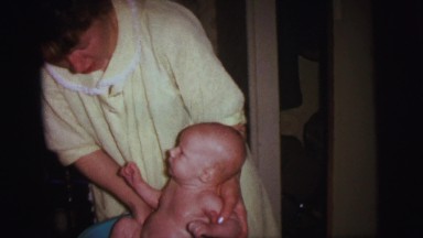 1972: a mother with a small child is seen LYNBROOK, NEW YORK