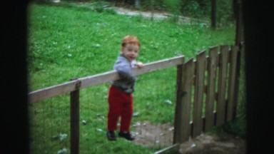 1972: the boy realise to open door at park even he tries to jump the fence