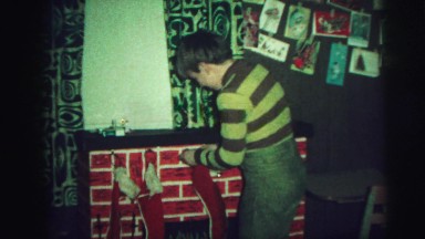1972: children hanging their stockings by the chimney ready for santa claus