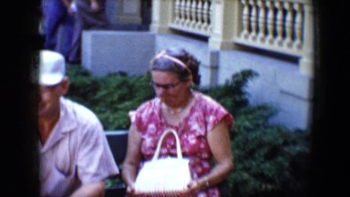 1959: A Family Chatting on a Park Bench at Disneyland, California
