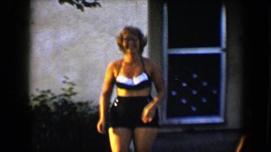 1959: Woman Performing Somersault in Garden at Disneyland