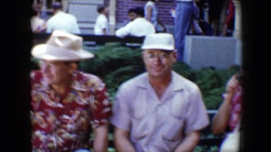1959: family remembrance of gathering for outdoor parade DISNEYLAND, CALIFORNIA