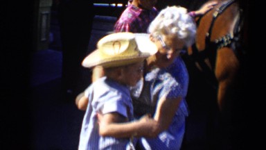 1959: a women playing with his children DISNEYLAND, CALIFORNIA
