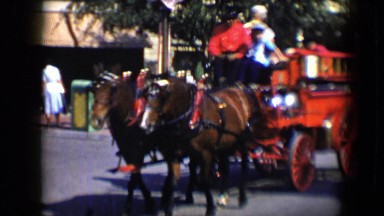 1959: horse-drawn wagon riding several people through the village DISNEYLAND,