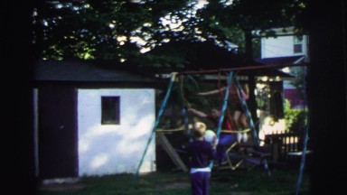 1972: Girl and Boy Playing While Guy Watches in Lynbrook, New York