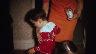 1972: mother controlling her son in a room LYNBROOK, NEW YORK
