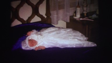 1972: it is christening day for this beautiful baby girl dressed in white.