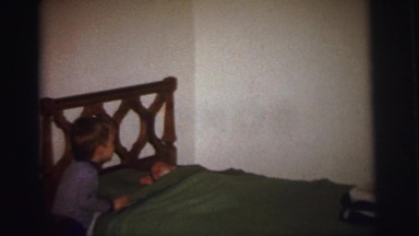 1972: older brother is checking on a baby LYNBROOK, NEW YORK