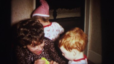 1972: woman is getting ready to start playing with two small children