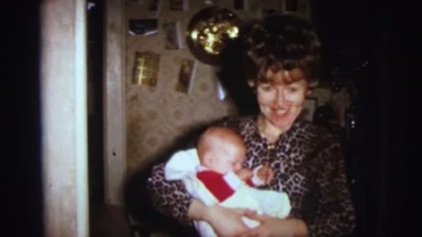 1972: Mother Dresses Babies in Red for Festive Visit