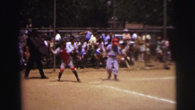 1972: baseball seen with people watching LYNBROOK, NEW YORK