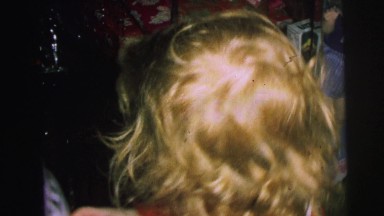 1972: celebration among family while opening gifts on christmas LYNBROOK