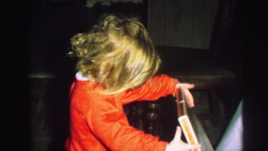 1972: children in their pajamas opening present on christmas morning. LYNBROOK,