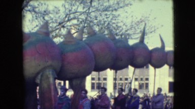 1948: People Walking in a Festive Parade on a Busy Baltimore Street