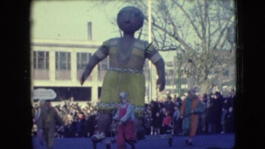 1948: parade displays turn a corner, santa, native american balloon, and a pink