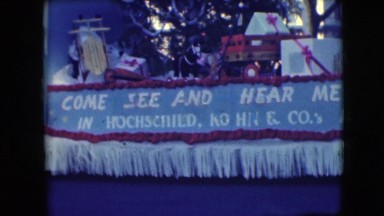 1948: parade with large floats fashioned as animals escorted by clowns
