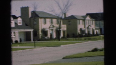 1951: view of midcentury houses on street with automobiles CHATHAM, NEW JERSEY