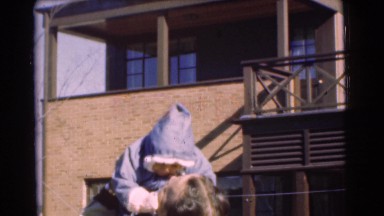 1951: man holding child and playing with child CHATHAM, NEW JERSEY