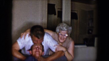 1958: a group of people of all ages have fun in the living room of the house