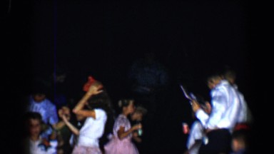 1958: children at a party waiting around the table with punch and treats TUCSON,