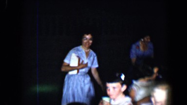 1958: two young ladies serving children with the drinks in cups TUCSON, ARIZONA