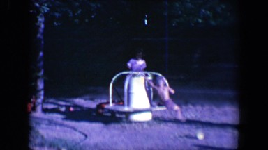 1958: kids spin on playground equipment TUCSON, ARIZONA