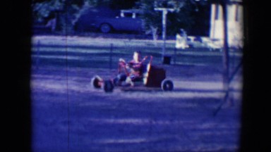 1958: childrens are playing in a playground and rides a car TUCSON, ARIZONA