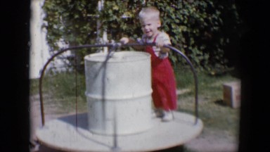 1958: round and round goes a small boy at play in the park TUCSON, ARIZONA